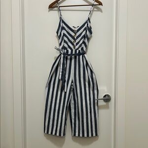 Black and White Sleeveless Jumpsuit with Wide-Leg Cropped Pants and V-Neckline